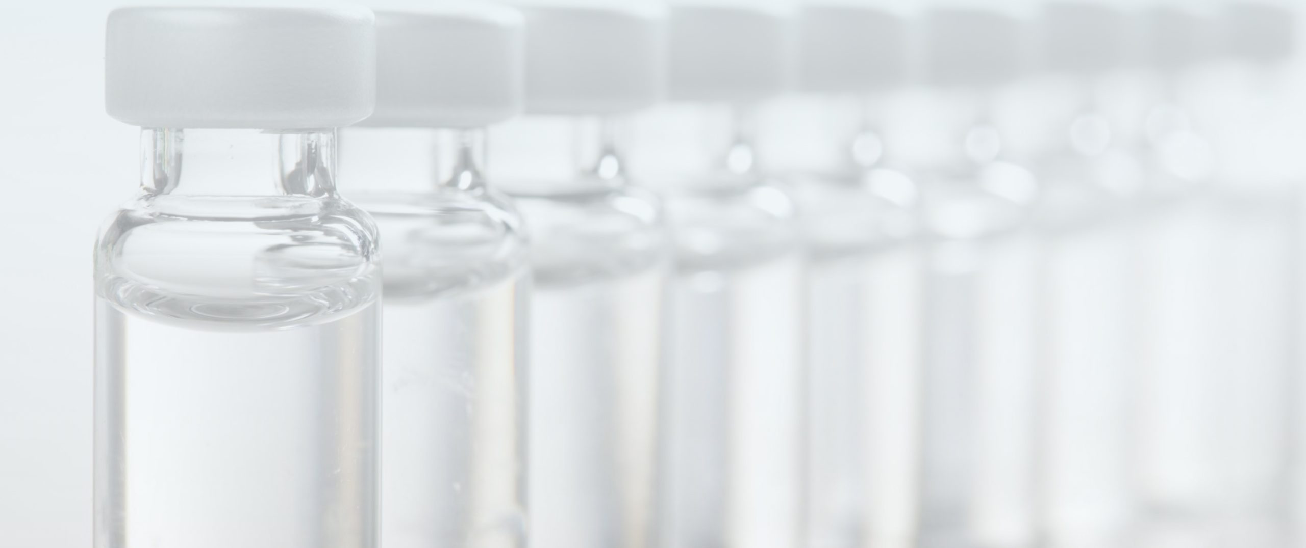 image with glass vials with clear liquid